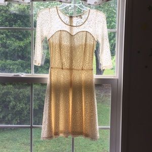 I am selling a cream colored lace love fire dress.